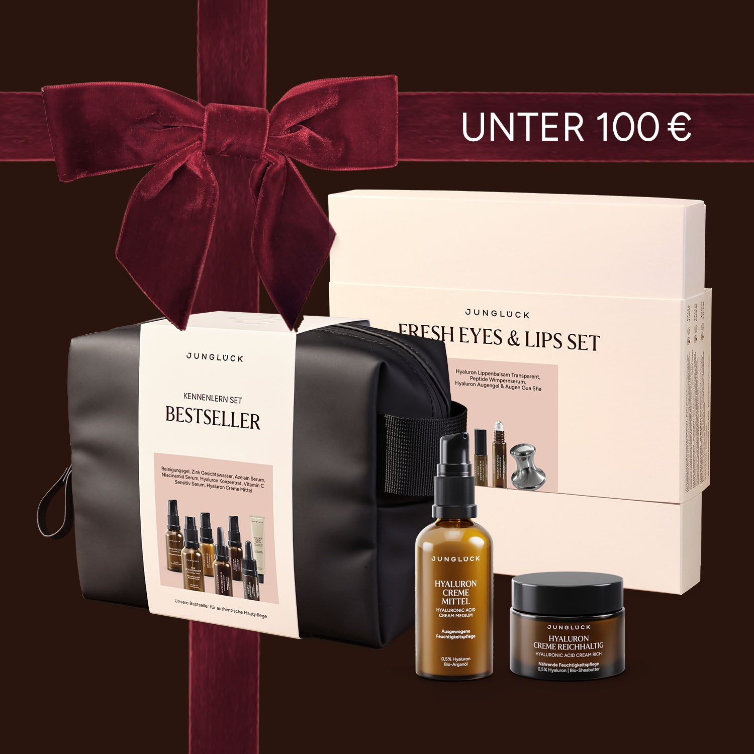 Geschenkset von JUNGLÜCK mit schwarzer Kosmetiktasche, Hyaluron-Sérum und Augen-/Lippen-Pflege im Set.