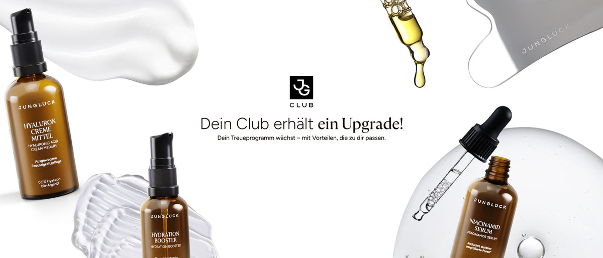 Drei Braunglasflaschen von JUNGLÜCK: Hyaluron Creme Mittel, Hyaluron Booster und Magnesium Serum. Darunter der Text "Dein