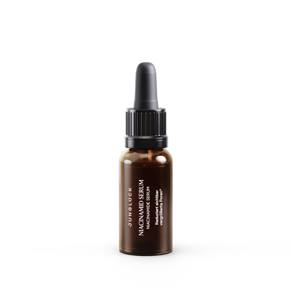 Braunglasflasche mit Pipette, gefüllt mit JUNGLÜCK Niacinamid Serum, 10ml, klarer Schriftzug.
