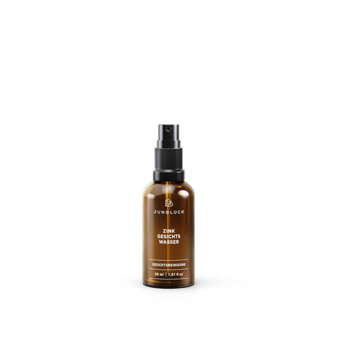 Braunglasflasche mit Zink Gesichtswasser (30ml) von JUNGLÜCK, Pumpkopf, klare Beschriftung.